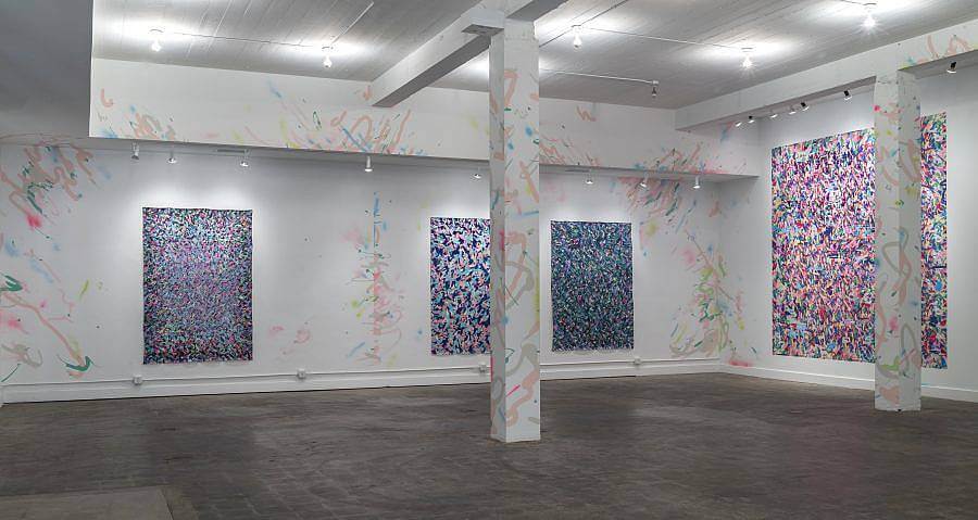 Image description: Featured in an installation view of 2016 Charlotte Street Visual Artist Awards  Exhibition at the Kemper Museum of Contemporary Art. In the exhibition there are four large paintings that have many small marks in various colors. The brushstrokes and marks continue onto the walls and supports in the gallery.