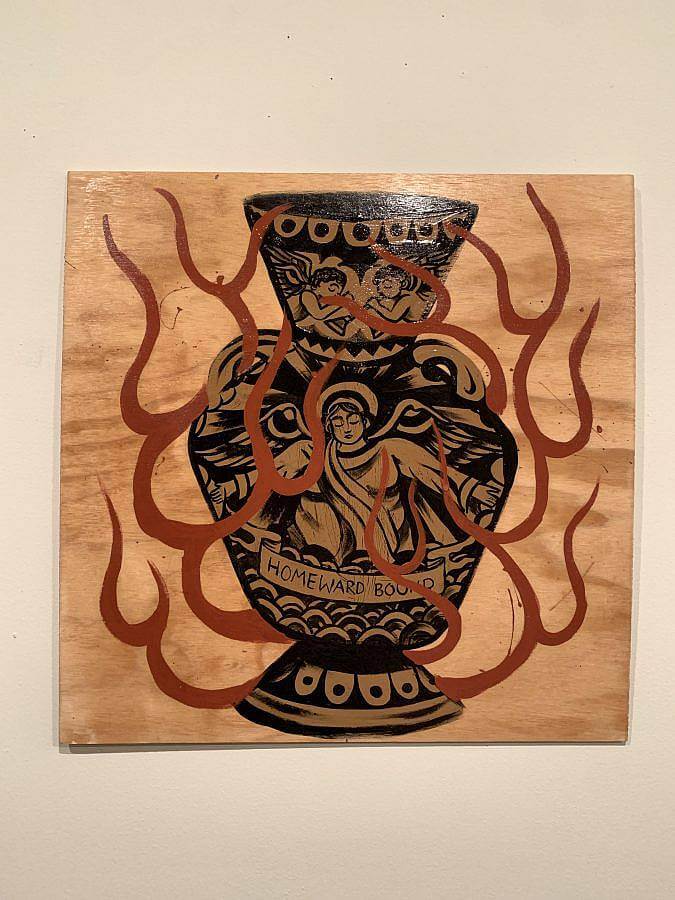 Photo of a woodstain and latex painting on plywood. There is a vase with angels painted on it. A painted banner reads "Homeward Bound," on the bottom of the vase. Red flame line work encircles the vase. 