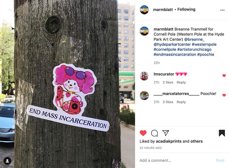A sticker illustration is on a telphone pole. The sticker is an image of an illustrated pink and purple dog. Below her reads "End mass incarceration" in all caps. This image is a actually part of a screenshot of an instagram page.
