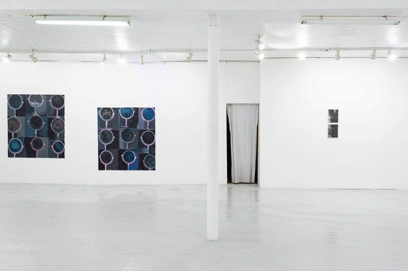 This is an installation shot of the exhibition. In the center is a doorway out of the gallery. To the left, is one painting from Madeline Gallucci's 