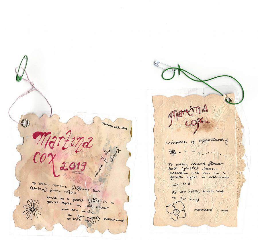 Image description: Scan of two hand made tags that each reach Martina Cox. They. look like burnt paper and are handwritten with washing and drying instructions. 