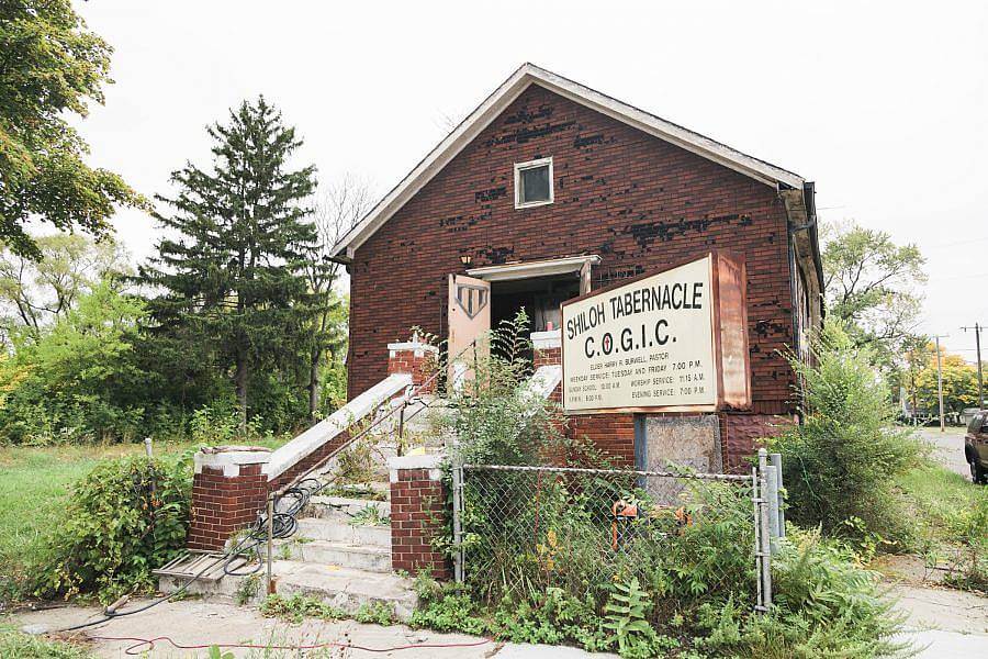 Image description: A red brick church is displayed. It says Shiloh Tabernacle on a massive sign in front. 