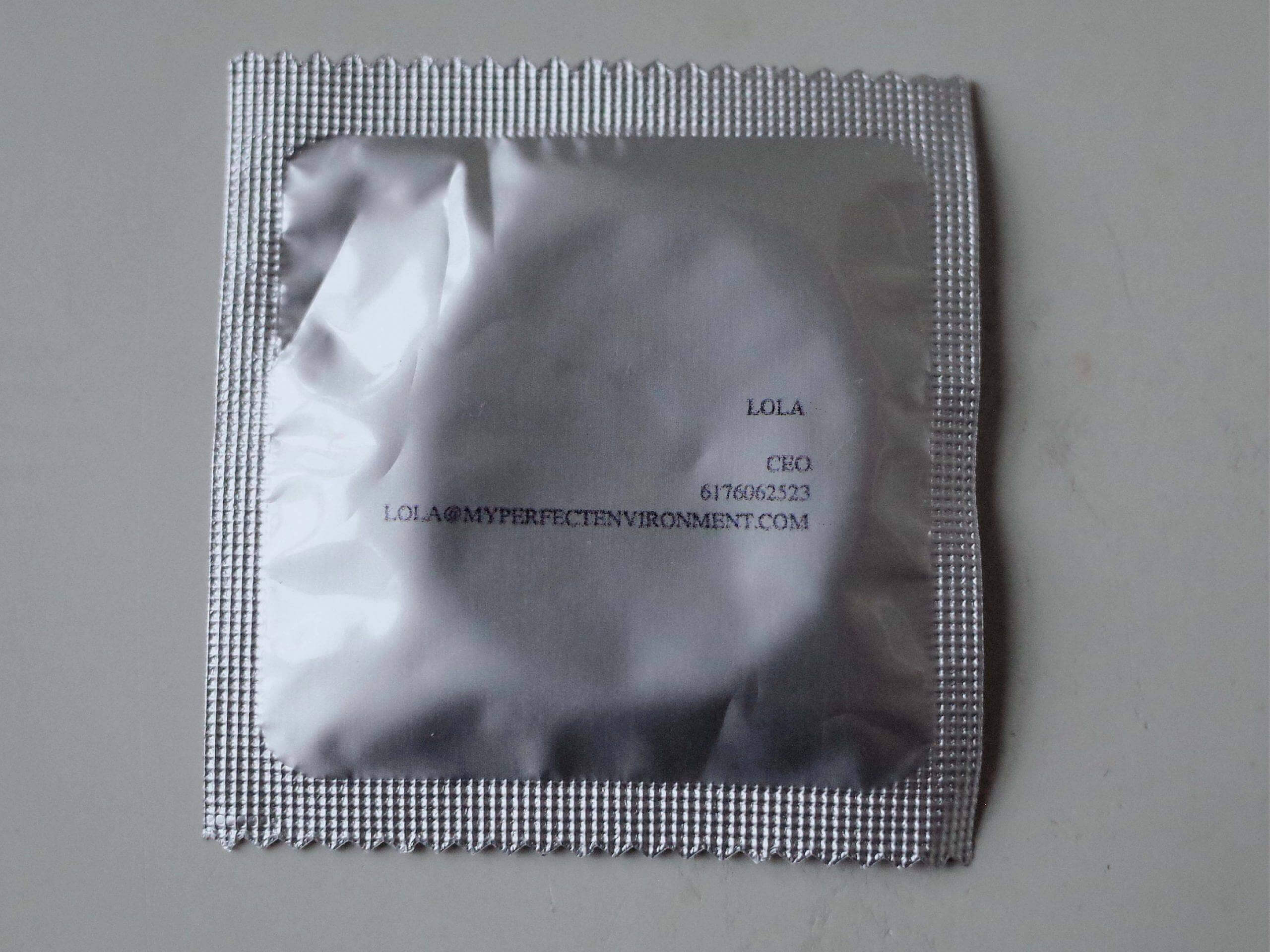 condom wrapper with business card information printed on it