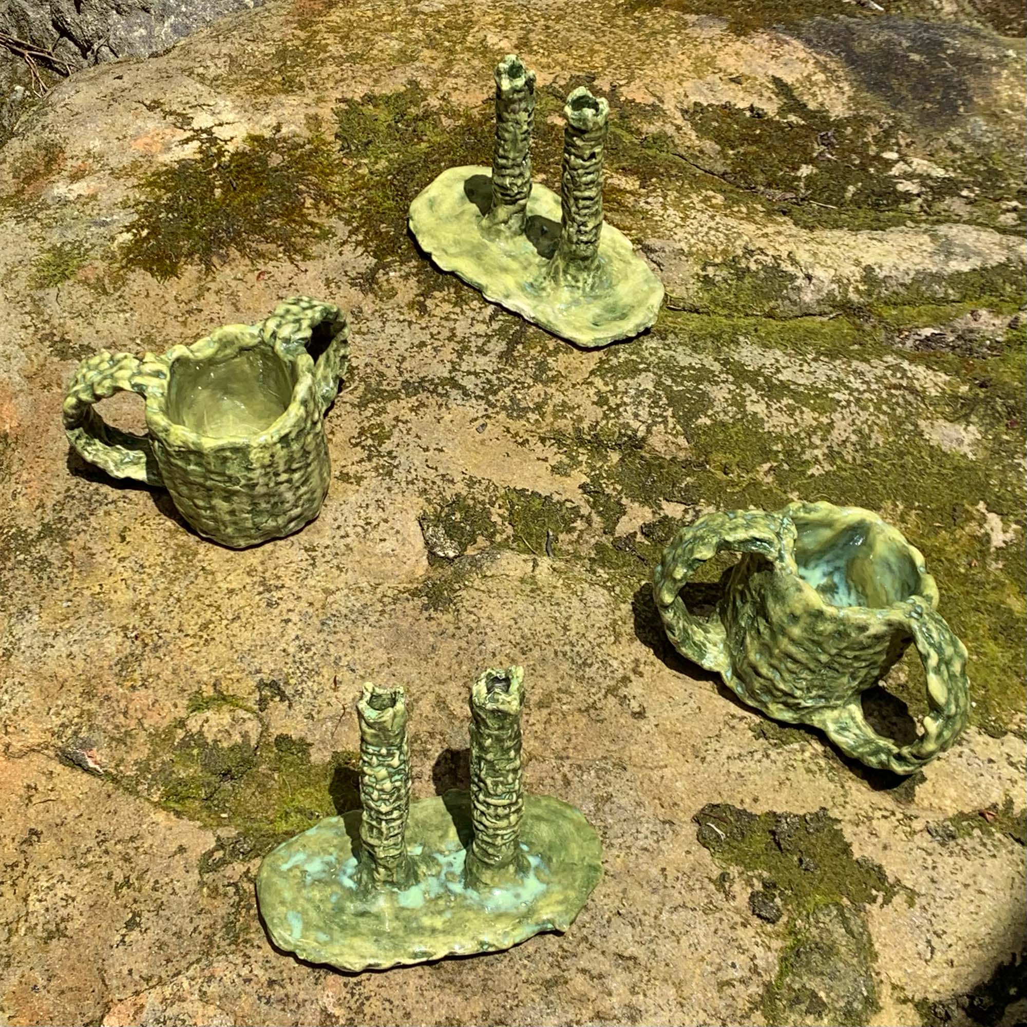 green ceramic objects sitting outside